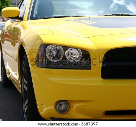 Front corner of a bright yellow sports car
