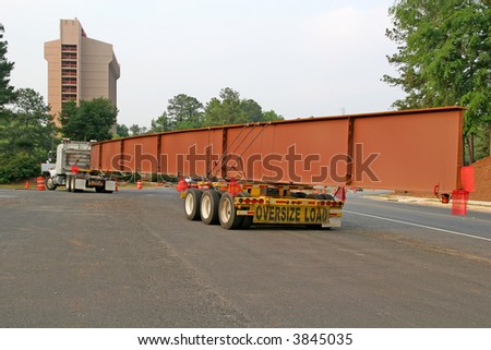 A huge steel beam for bridge construction on a truck