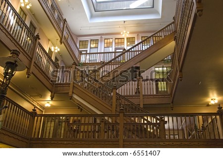 Interior shot of open retail area with many old wooden staircases