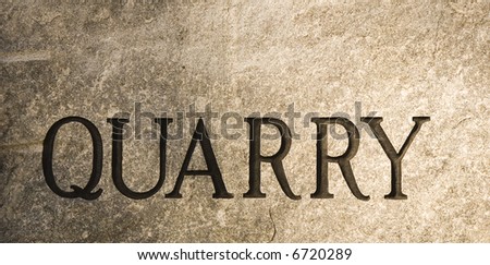 A slab of granite with the word quarry carved into it