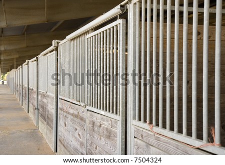 A long row of horse stalls at a stable