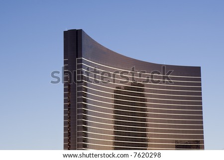 A curved black and white high rise hotel in las vegas