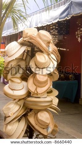 A rack of handmade straw cowboy hats