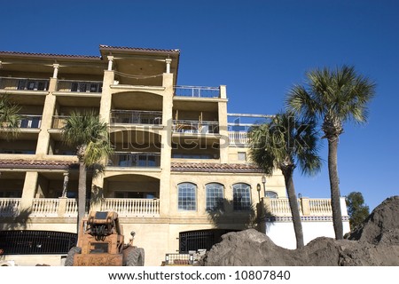 A new condominium construction project of stucco in a tropical setting