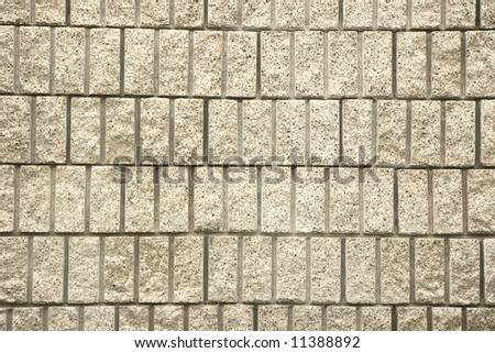 A wall of cut concrete blocks useful for background or texture
