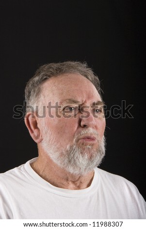An older guy appearing to be lost in deep thought
