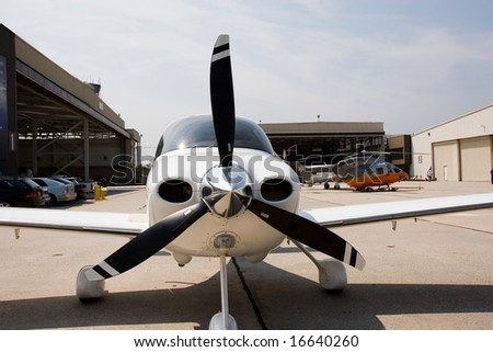 A small private plane with black propellers