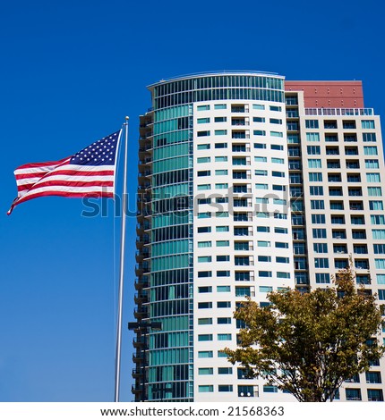 A nice new high rise condominium and an American Flag