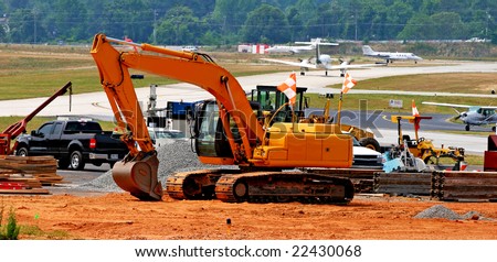 Heavy construction equipment working on an airport runway