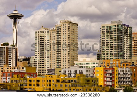 Many colorful buildings and space needle in the skyline of Seattle