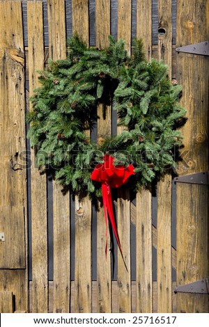 A Christmas wreath on an old barn door