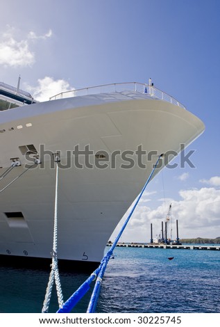 A large cruise ship at anchor in a port
