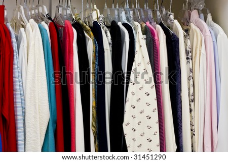 Colorful women\'s clothing in a closet or a retail store