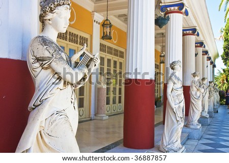 Row of statues and columns along a Greek palace