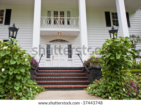 Brick Steps between gardens leading to colonial porch