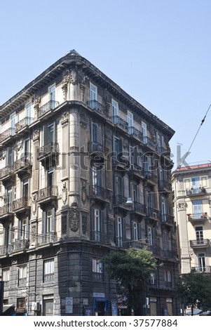 An old corner apartment or hotel building in Naples Italy