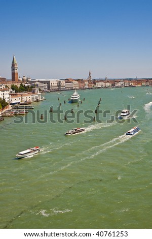 A view of many boats in the grand canal of venice italy