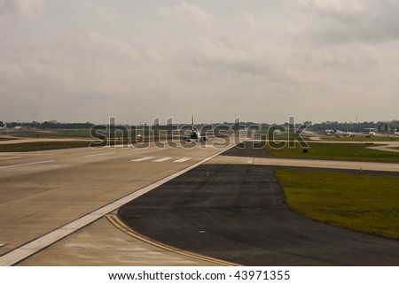 A commercial jet on a runway about to take off