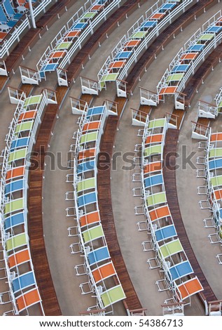 Rows of colorful chairs at an outdoor venue