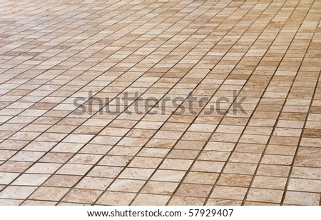 A large stone tile floor into the distance