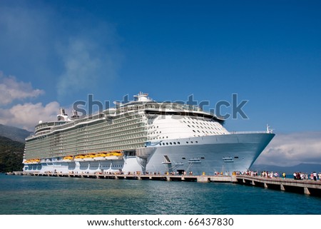 Passengers leaving a luxury cruise ship under blue sky