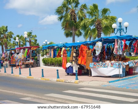 Colorful clothes and blankets at a tropical marketplace