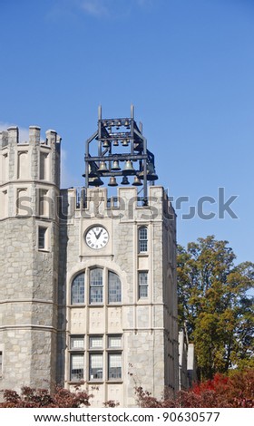 An old stone clock tower with bells