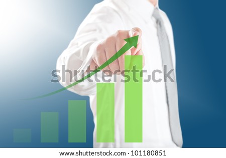 Business man pointing rising chart