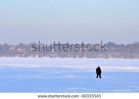 Man on Harriett lake of Minnesota in winter