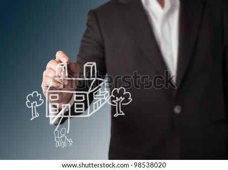 Business man drawing house with tree and family