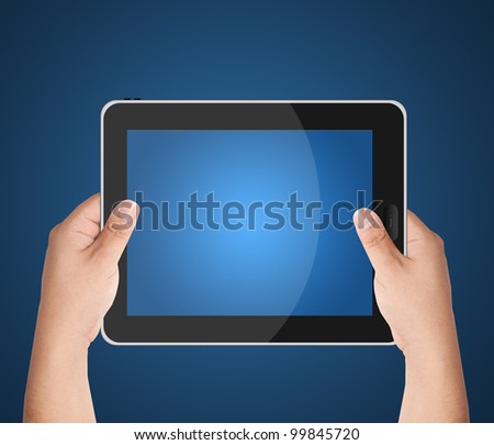 Hands holding tablet PC with blank blue screen isolated on blue background