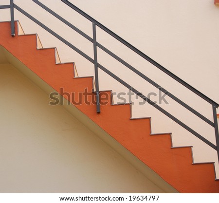 nice red stairs on a pink wall