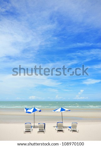 summer tropical beach with blue sky with umbrella and chair