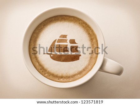coffee cup latte art with ship drawing