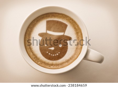 snow man drawing on latte art coffee cup