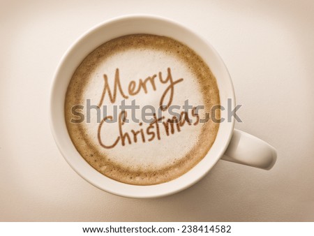 Merry christmas drawing on latte coffee cup