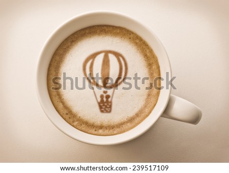 lover's balloon drawing on latte coffee cup