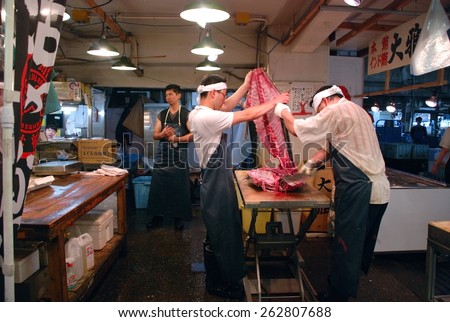TOKYO, JAPAN - JULY 22 : Tuna fish cutting at Tsukiji Market, the biggest wholesale market in Japan taken July 22, 2008 in Tokyo, Japan.