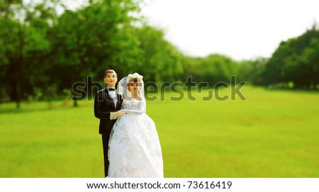 stock photo wedding bride and groom couple doll on grass ground field