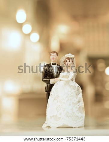 stock photo wedding doll with gold background