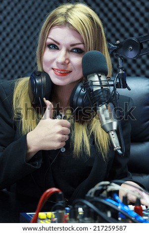 Beautiful Woman Thumbs Up While Recording Sound In Media Studio