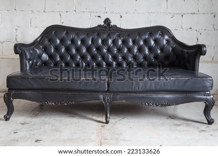 Luxury Black Classic Sofa On Brick Background