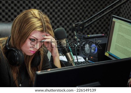 Hard Work Woman Serious And Moody While Working As Training DJ Radio Live Show In Studio
