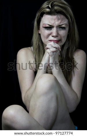 STOP Violence With Women, Scared and beaten white woman crying and begging on a black background