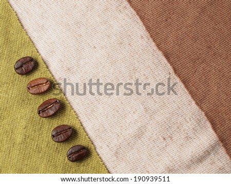 Roasted Coffee Crop Beans on fabric textile