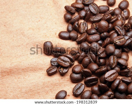 coffee crop beans on fabric textile texture background