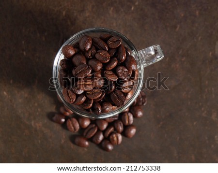 Coffee crop beans in little glass cup