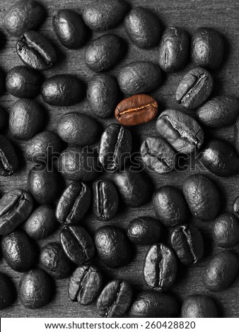 Coffee crop beans on wood texture background