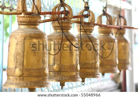 The line of thai style old gold bell. In perspective.