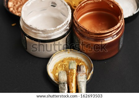 Brushes and paint jars